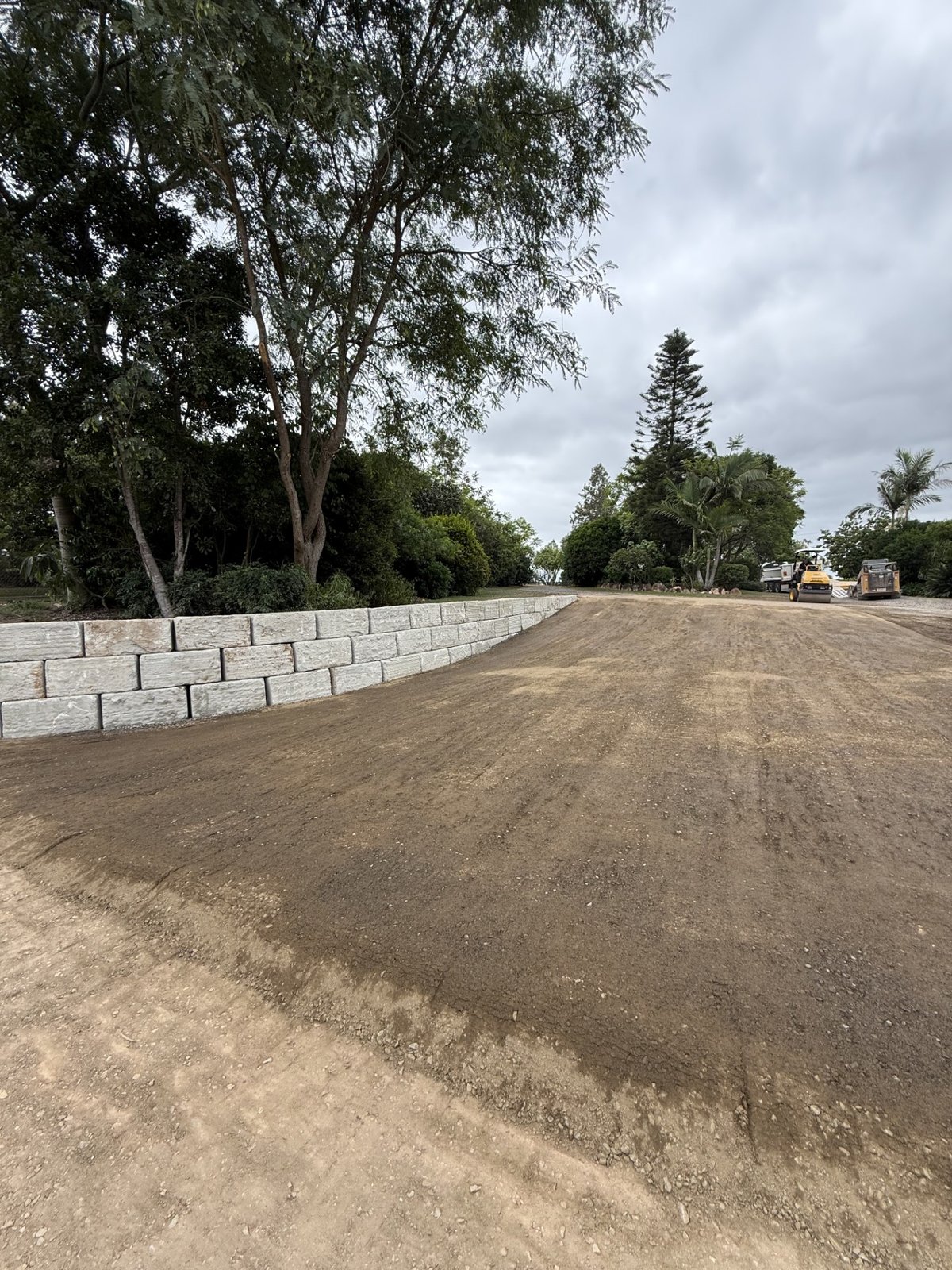 CAT 255 compact track loader levelling horse arena sand