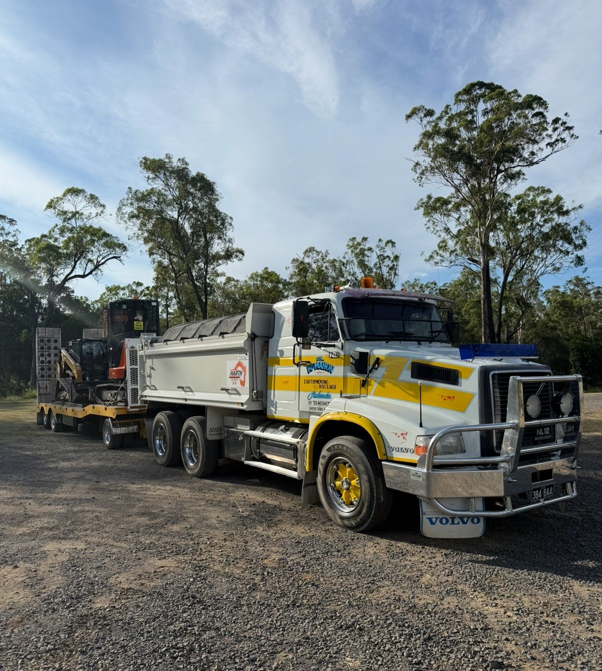 Curved sandstone retaining wall with graded site